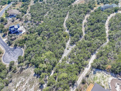 Aerial view of property's location featuring a he