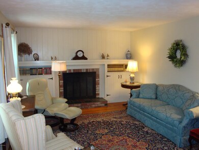 Living room with wood burning fireplace