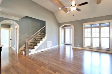 Great Room With Beautiful Cedar Beams On The Ceiling