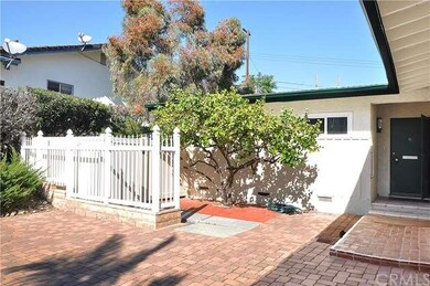 Front Entry with Fruit Tree and Privacy Fence