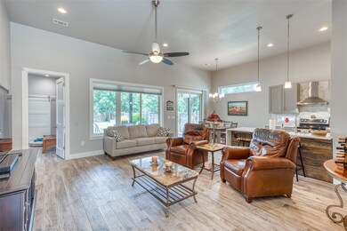 Living area with light wood-style flooring, ceili