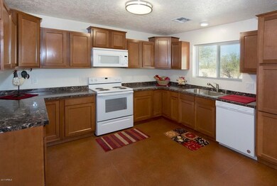 5  24230 E Cholla Rd