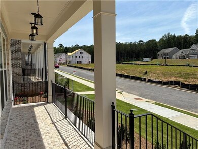 Enjoy your covered balcony!  Photo not of actual home, but previously built TPG home. For representation purposes only.