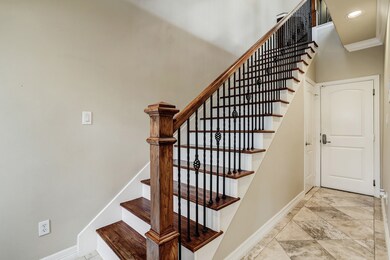 Beautiful staircase with wrought iron balusters