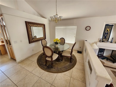 Dining area featuring light tile patterned floors,