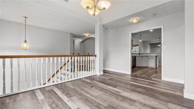Spare room featuring arched walkways, a sink, base