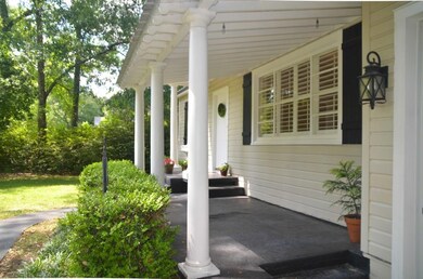 Enjoy the pretty yard from the front porch.