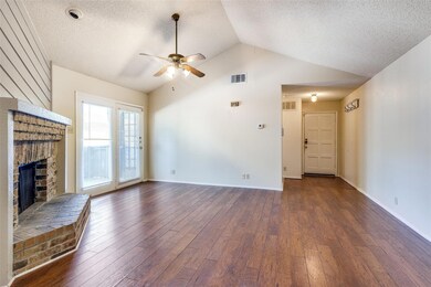 Unfurnished living room with ceiling fan, a firepl