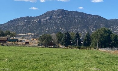 View of mountain background featuring rural landsc