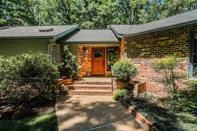 Aggregate walk leads from the driveway to the cove