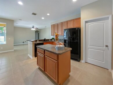 The kitchen overlooks the dinette space and family