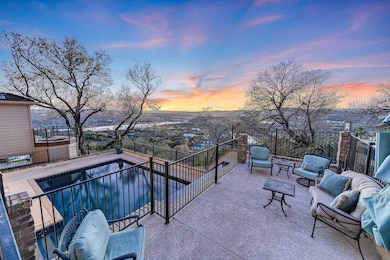 Patio terrace at dusk with an outdoor living spac
