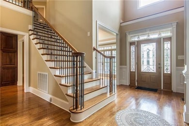 Beautiful foyer opens to two story great room, ele