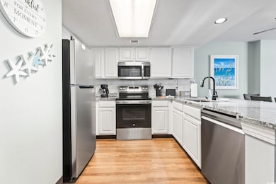 Kitchen with a sink, stainless steel appliances, w