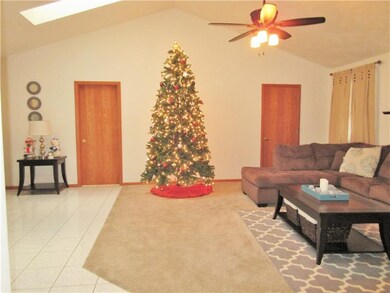 Living room: Cathedral ceiling, new ceiling fan wi