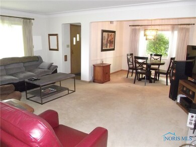 Spacious living room with coved ceilings and firep
