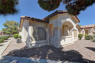 Mediterranean / spanish-style home featuring a tile roof and stucco siding