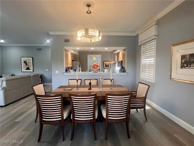 Dining area featuring crown molding and hardwood /