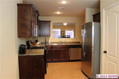Kitchen with Granite countertops, pantry, and stai