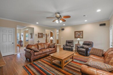 Living area with divine wood flooring throughout