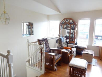 Stairs to entryway from living room