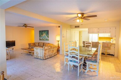 Tiled dining space with ceiling fan