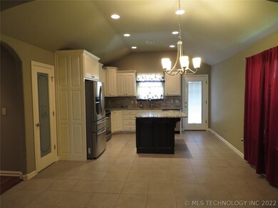 Granite Kitchen open with large pantry and island.