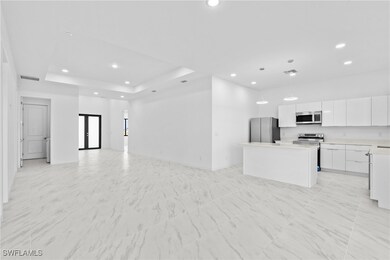 Unfurnished living room featuring recessed lightin