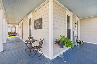 Porch swing is a must have for this awesome porch