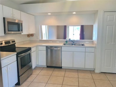 Light and bright kitchen with pass-through to brea