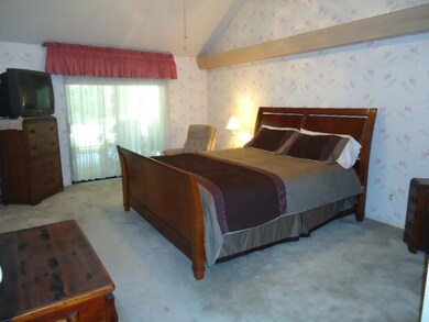 Master bedroom includes a slider to the back patio