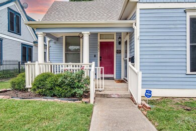Property entrance featuring a covered porch & dogg