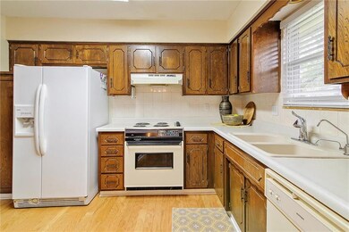 Stained cabinets offer plenty of storage! Neutral 
