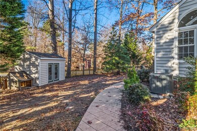 Fenced in back yard with shed on corner lot.