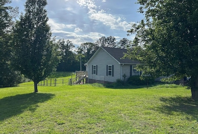 View of property exterior featuring stairway
