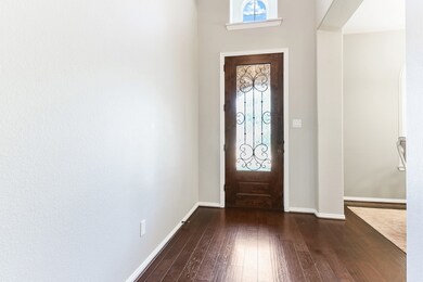 As you enter the home you will see beautiful hardwood floors throughout and high ceilings.