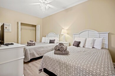 Bedroom with ceiling fan, hardwood / wood-style fl