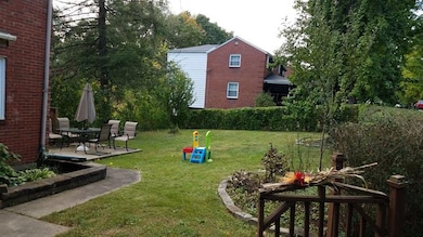 Yard to the side of the home flat and great for ki