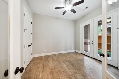 This room is bright and inviting, featuring wood-l