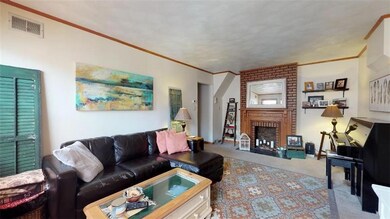 Upper Unit - Generous sized living room with decor