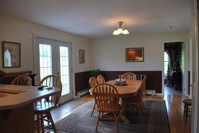 Dining room with hardwood offers...