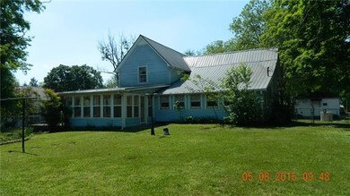 View of the back and sun room