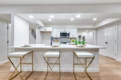Kitchen featuring a spacious island, stainless ste