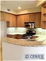 Kitchen with granite counters, stainless appliance