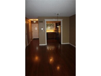 Living/dining room with a view into the kitchen