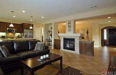 Cozy dual sided fireplace between the formal dinin
