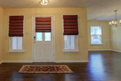 This charming and welcoming front entry embraces g