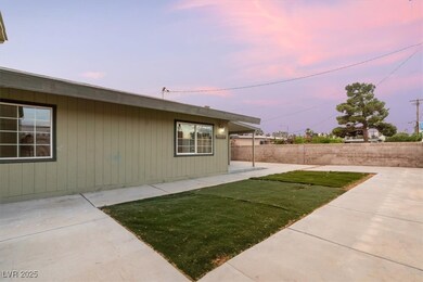 Yard at dusk featuring Synthetic Grass and a Large