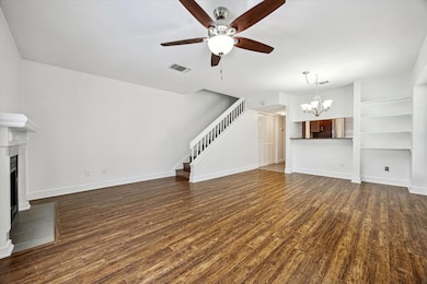 Unfurnished living room with ceiling fan with not