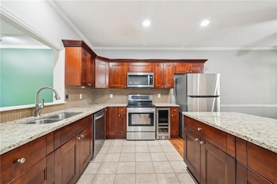 Kitchen featuring beverage cooler, a sink, crown m